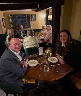 Shaun Murphy and Jo Rochell at a restaurant table with other diners.