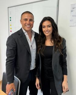Photo of a man and a woman posing together.