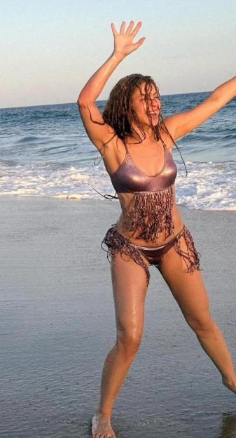 Shakira playing on a beach in Mexico.