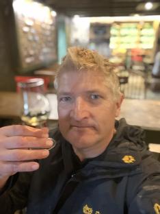 Man holding a glass of wine.