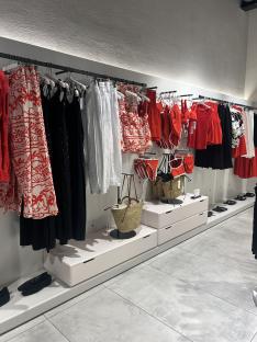 Clothing and accessories displayed in a retail store.