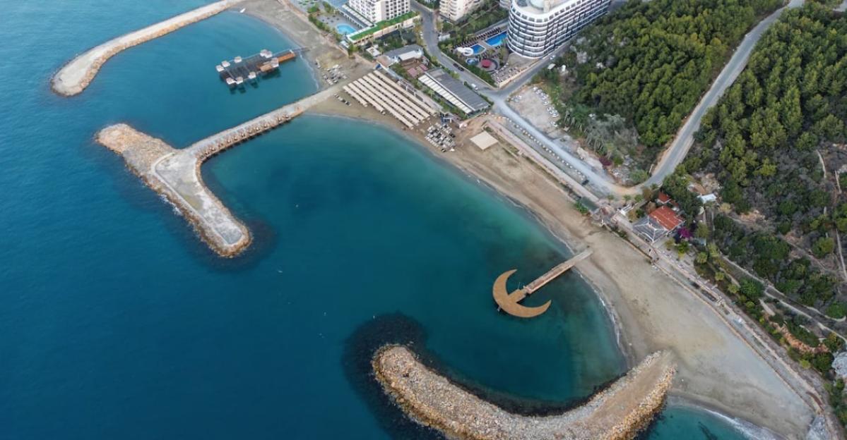 Aerial view of Noxinn Deluxe Hotel private beach in Alanya, Turkey.