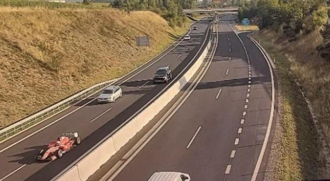 Formula One car on a highway.