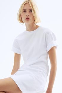 Woman in a white t-shirt dress.