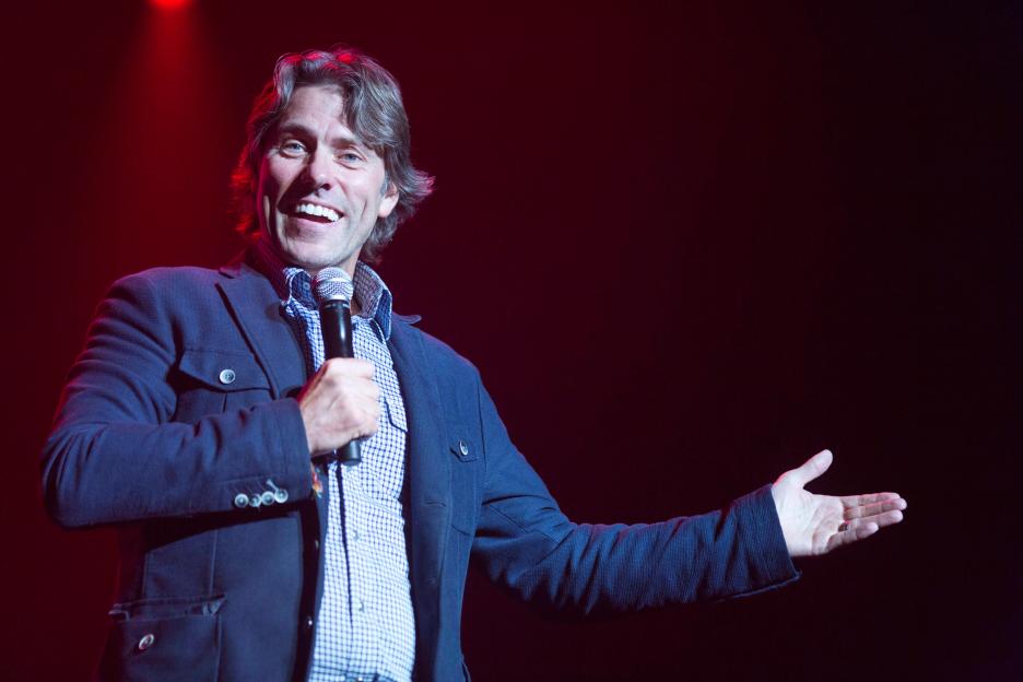 John Bishop performing stand-up comedy.
