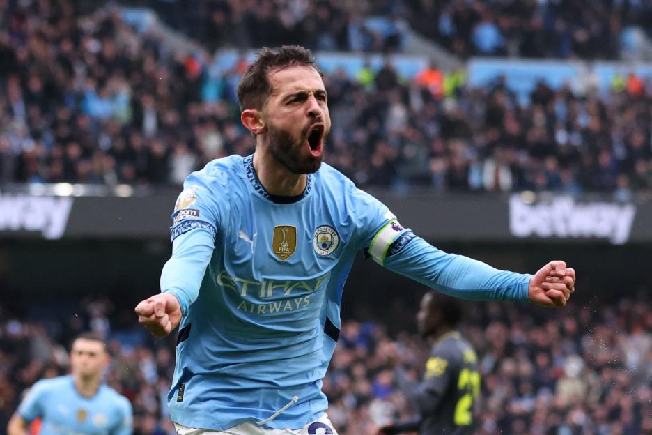 Manchester City's Bernardo Silva celebrates scoring the first goal against Everton.