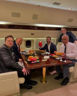 Elon Musk, Donald Trump, Donald Trump Jr., Mike Johnson, and Robert F. Kennedy Jr. seated at a table on a private jet, eating McDonald's.