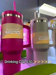Two Superdrug drinking cups, pink and grey, £10.