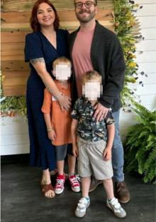 Family portrait of a woman, man, and their two sons.