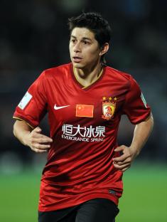 Golfer on a green with an American flag.
