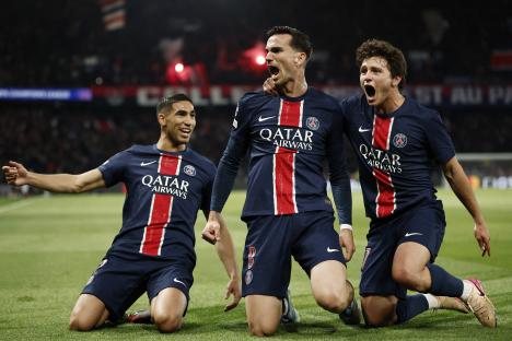 Paris St Germain players celebrating a goal.