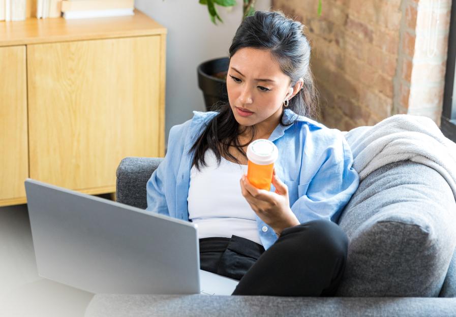 Woman on a video call with her pharmacist, reviewing her prescription.