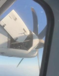 Airplane engine cover detached mid-flight.