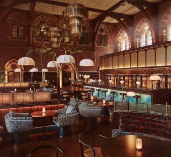 Interior view of a bar in a historic building.