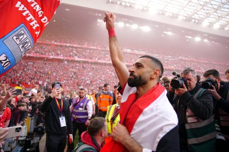 Mohamed Salah celebrates a victory at Anfield.