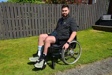 Man in wheelchair in his garden.