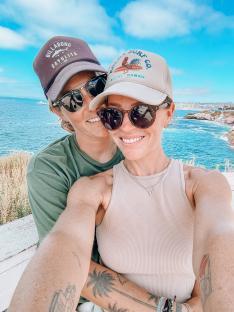 Selfie of a couple embracing near the ocean.