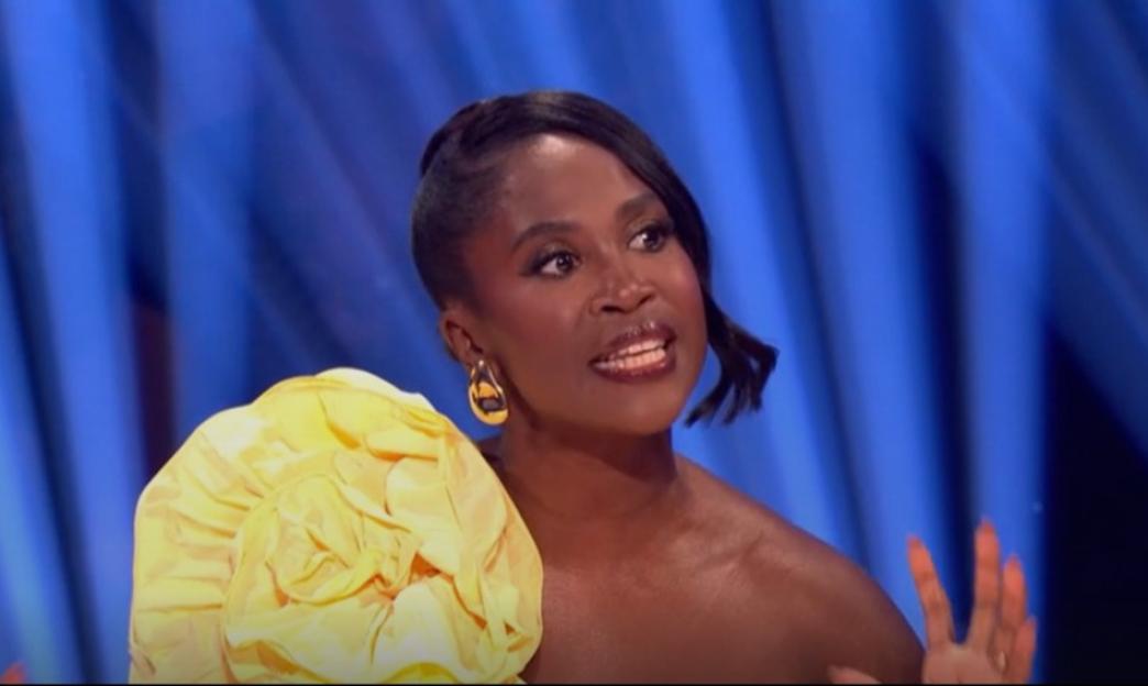 Karen Gibson wearing a yellow floral top.