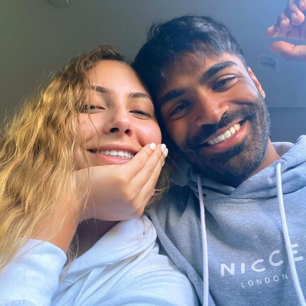 Nas Majeed and Eva Zapico smiling together.