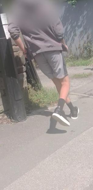 A man walking away from the camera.
