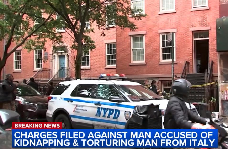 NYPD vehicle outside a building where a man was allegedly kidnapped and tortured.