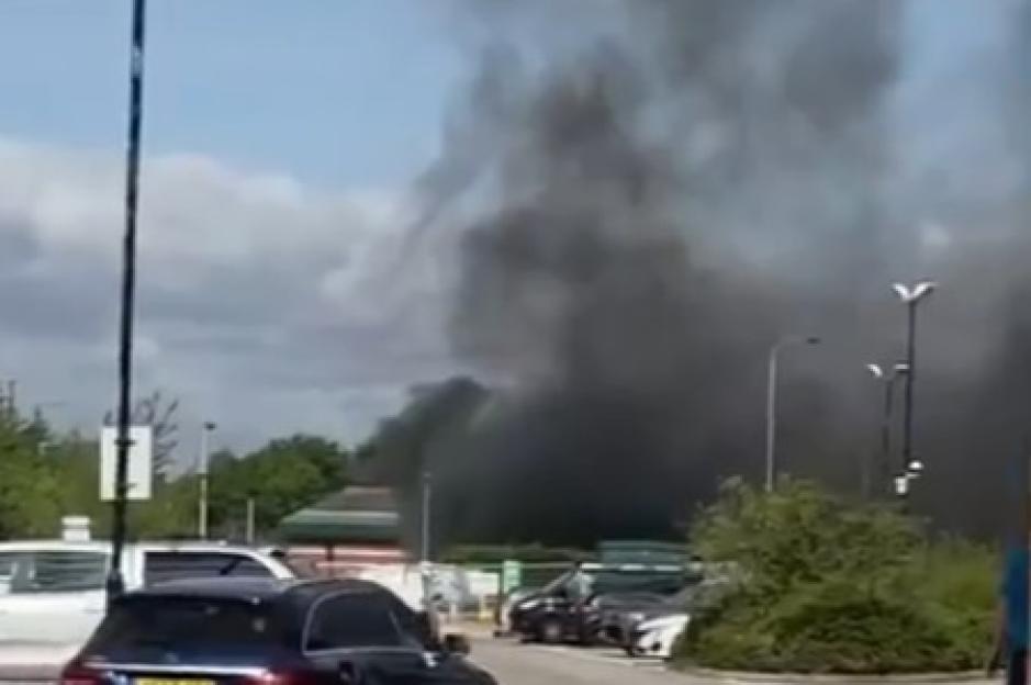 Massive fire erupts at Morrisons petrol station with thick plumes of smoke billowing over city