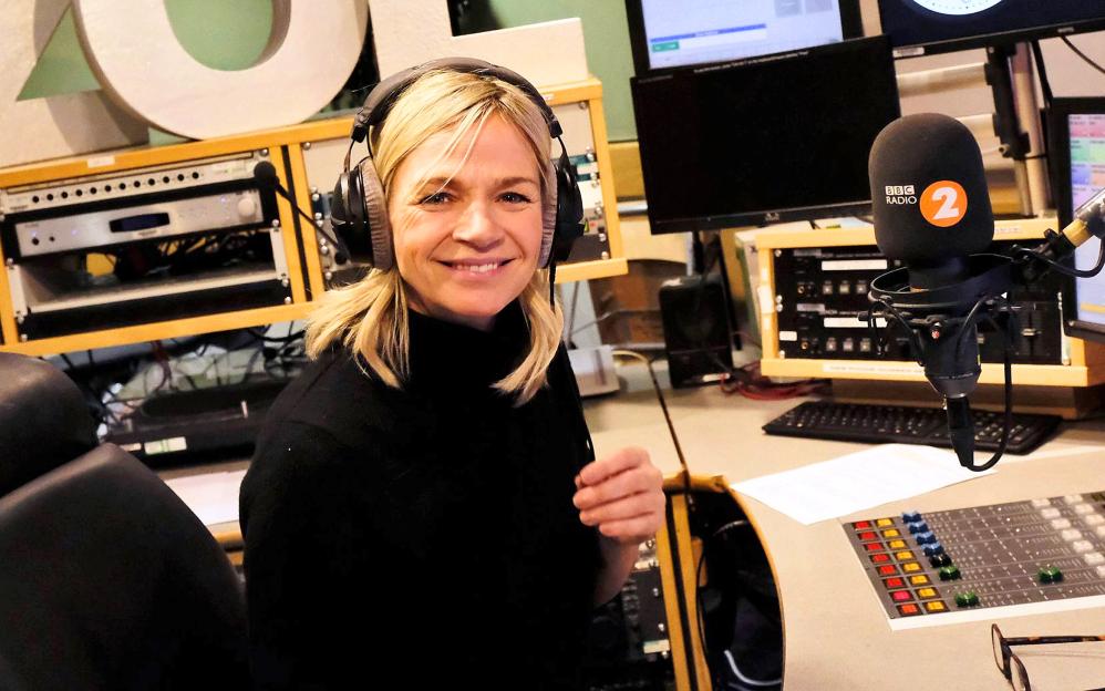 Zoe Ball, BBC Radio 2 DJ, at her radio station console.