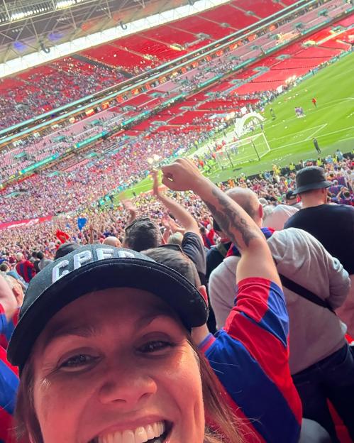 Happy Crystal Palace fan celebrating their FA Cup victory.