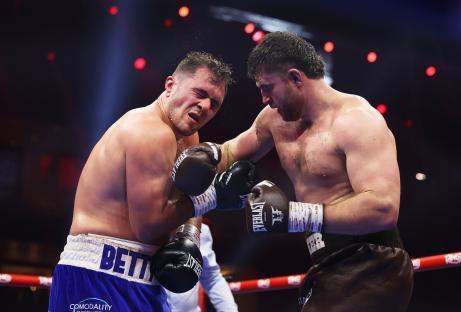 Johnny Fisher punches David Allen in a boxing match.