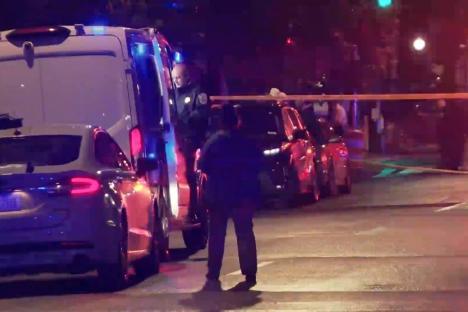 Crime scene with police and emergency vehicles.