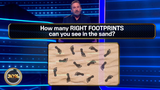 Screenshot of a game show question: How many right footprints can you see in the sand? Sand with footprints is shown.