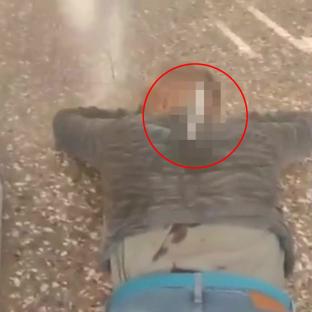 Shocking moment stabbing victim drags himself into shop with knife STILL sticking out of his back before collapsing