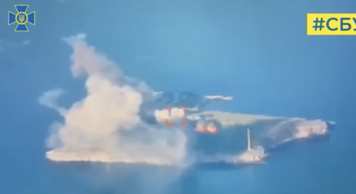 Screenshot of a ship exploding at sea.