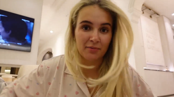 Woman with blonde hair speaking to camera.