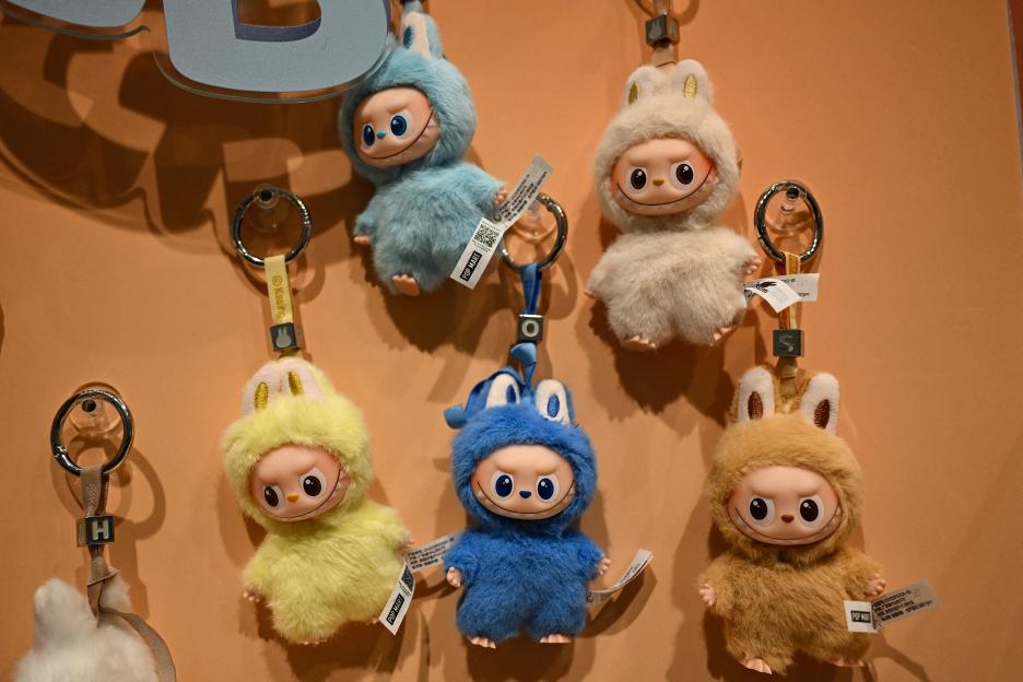 Mini Labubu keychains displayed in a shop.