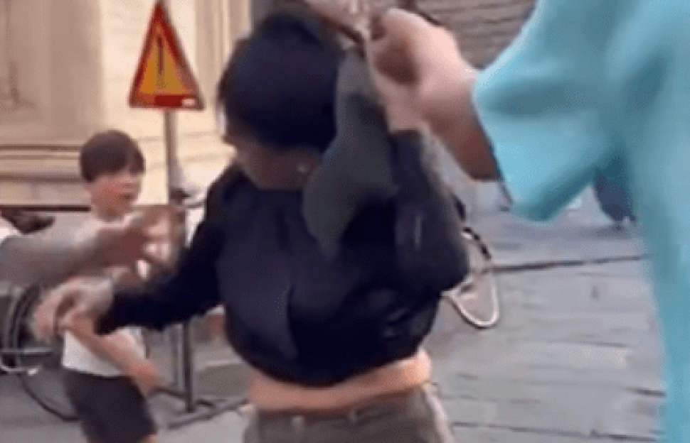Shock moment ‘pregnant pickpocket’ is grabbed by her hair by husband who ‘spotted her stealing from his wife’