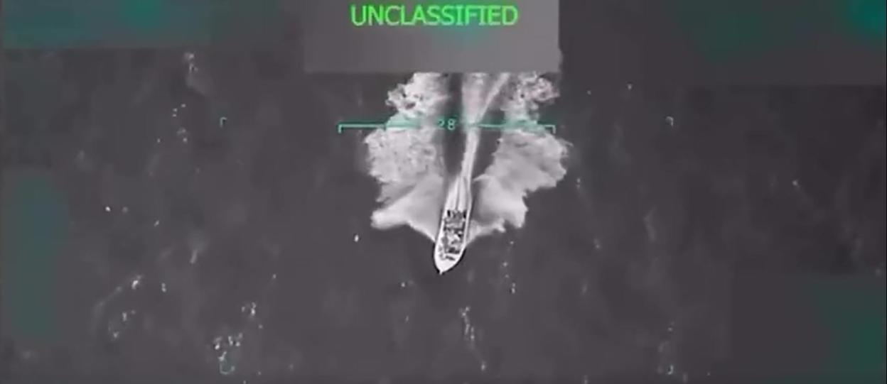 Night vision footage of a boat at sea.