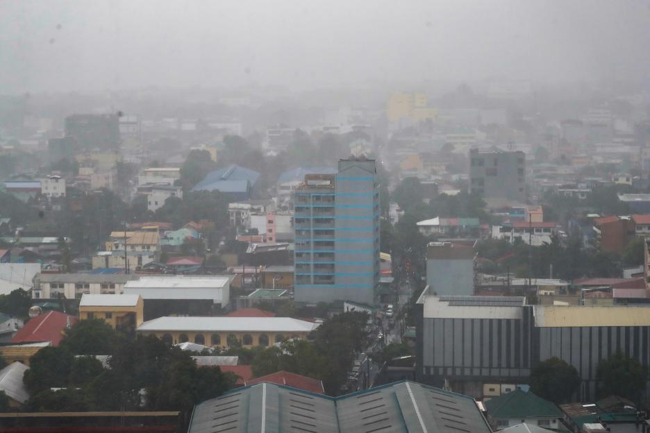 Aerial view of Metro Manila obscured by heavy rain and strong winds during a super typhoon.