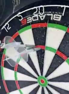 Frank Lampard throwing a dart at a dartboard.