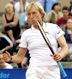 Martina Navratilova celebrates after winning a tennis point.