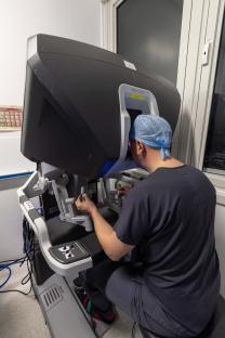 Surgeon performing robotic keyhole surgery.