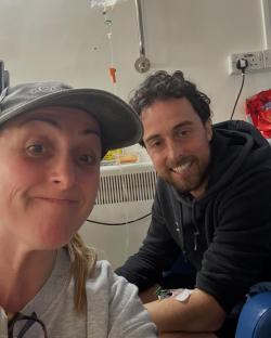 Natalie Cassidy with a man in a hospital room.