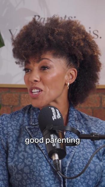 A woman with curly hair talking into a microphone labeled "Tommee Tippee" with the text "good parenting" overlaid on the image.