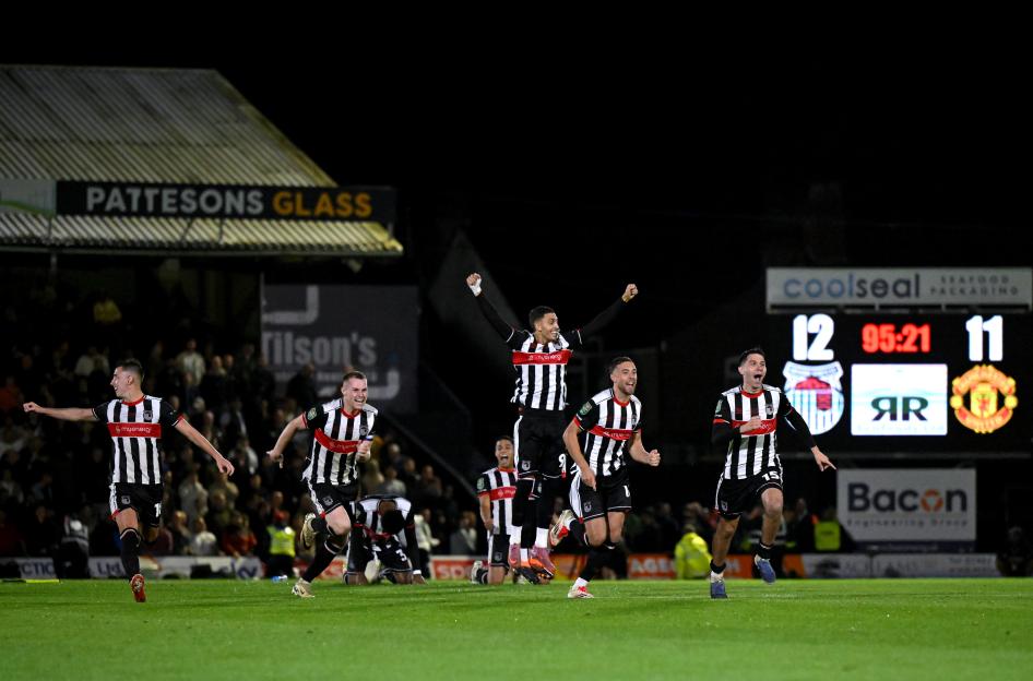 Grimsby Town players celebrating a victory.