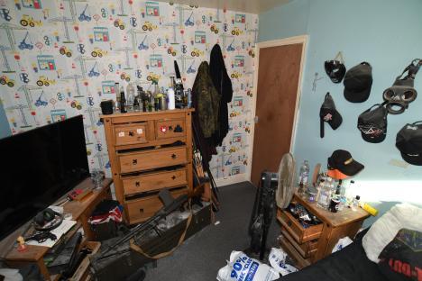 Photo of a messy bedroom belonging to a right-wing extremist convicted of planning terrorist attacks.