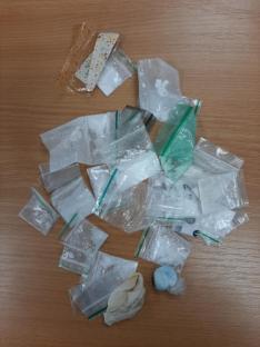 Seized drugs: cocaine, ketamine, and cannabis in small bags.