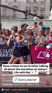 A woman embracing a runner at the finish line of a marathon.