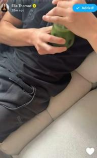 Screenshot of a person holding a green smoothie.