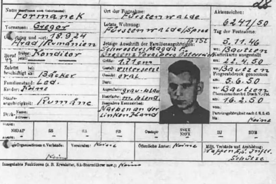 A German SS guard document for Gregor Formanek with his personal details and a small portrait photo.