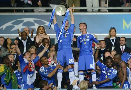John Terry of Chelsea lifts the UEFA Champions League trophy.